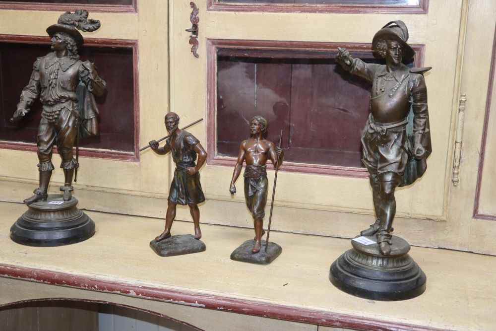 A pair of spelter cavaliers, height 52cm and a pair of Indian warriors